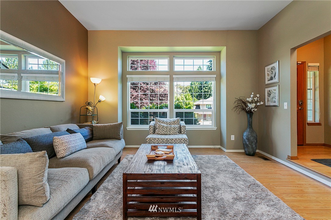 19602 9th Drive Southeast Bothell, WA 98012 - Photo 6 of 20 a living room with furniture and a large window