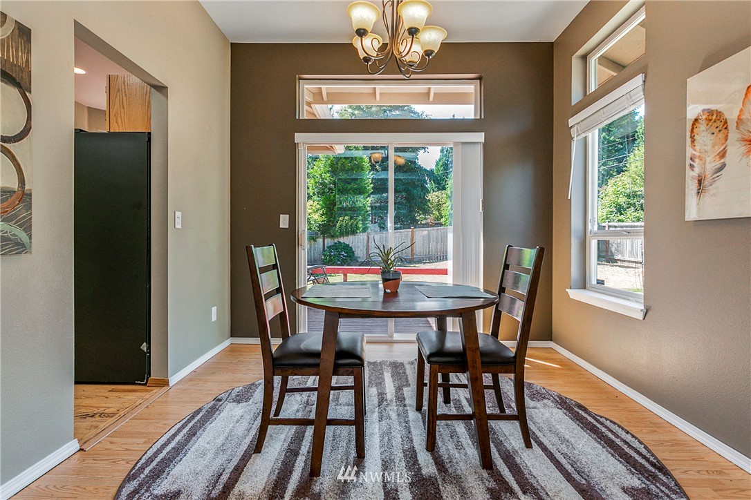 19602 9th Drive Southeast Bothell, WA 98012 - Photo 8 of 20 a view of a dining room with furniture window and outside view