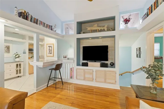 a kitchen with stainless steel appliances kitchen island granite countertop a refrigerator and a cabinets