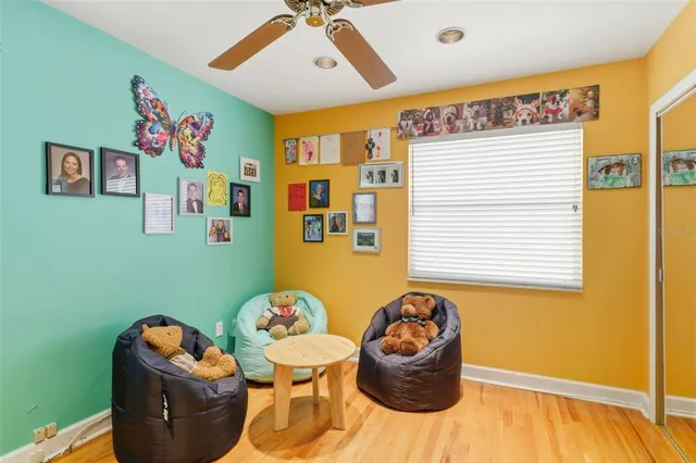a view of a livingroom with furniture and a window