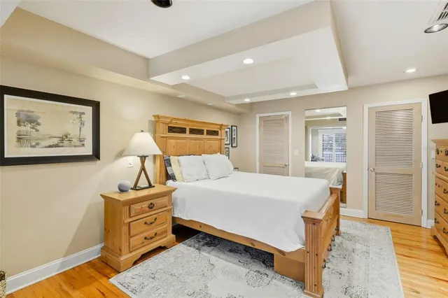 a bedroom with a large bed and a large window