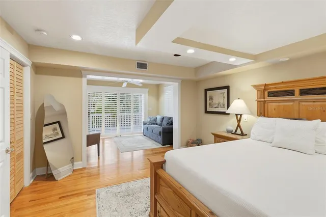 a bedroom with a bed and couch