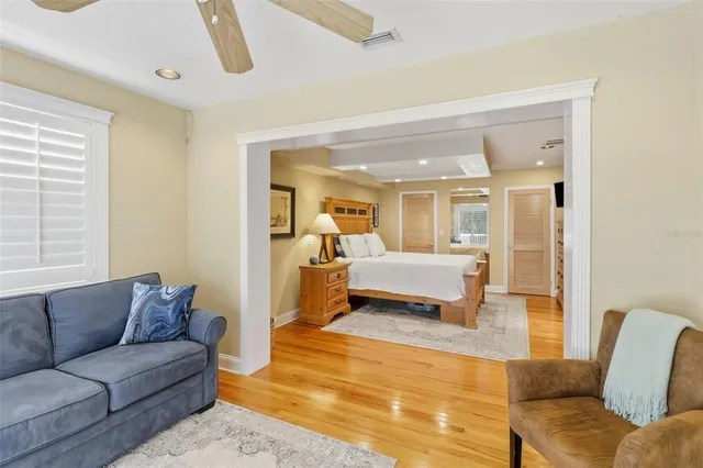 a view of walk in closet with clothes