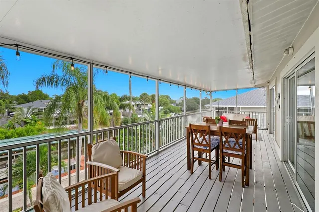 a view of a living room and balcony