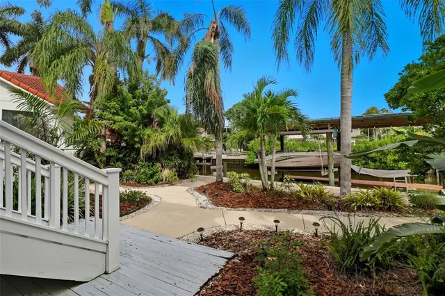 a balcony with furniture and a potted plant