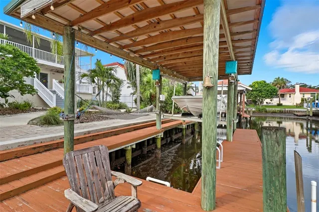 a view of backyard with outdoor seating and plants