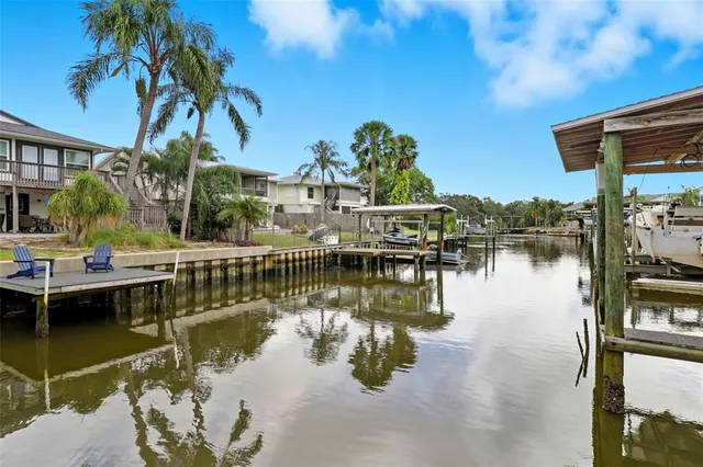 a front view of a house with garden and patio