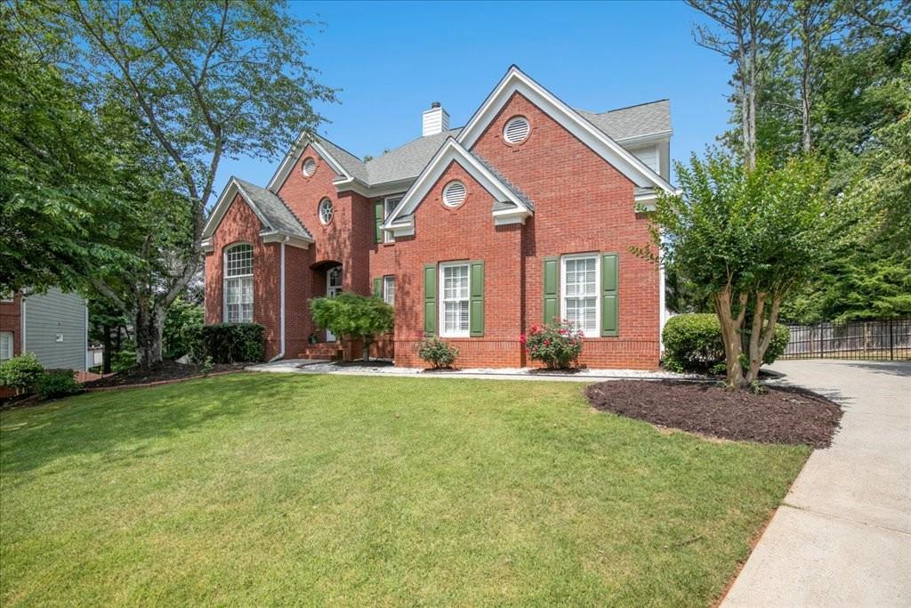 455 Park Creek Drive Alpharetta, GA 30005 - Photo 1 of 1 a front view of a house with a yard and porch