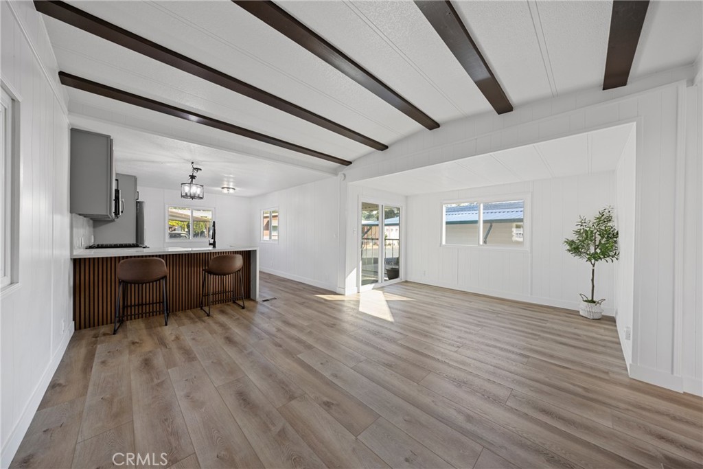 1255 Amethyst Street, Unit 51 Mentone, CA 92359 - Photo 14 of 60 a living room with furniture and a wooden floor