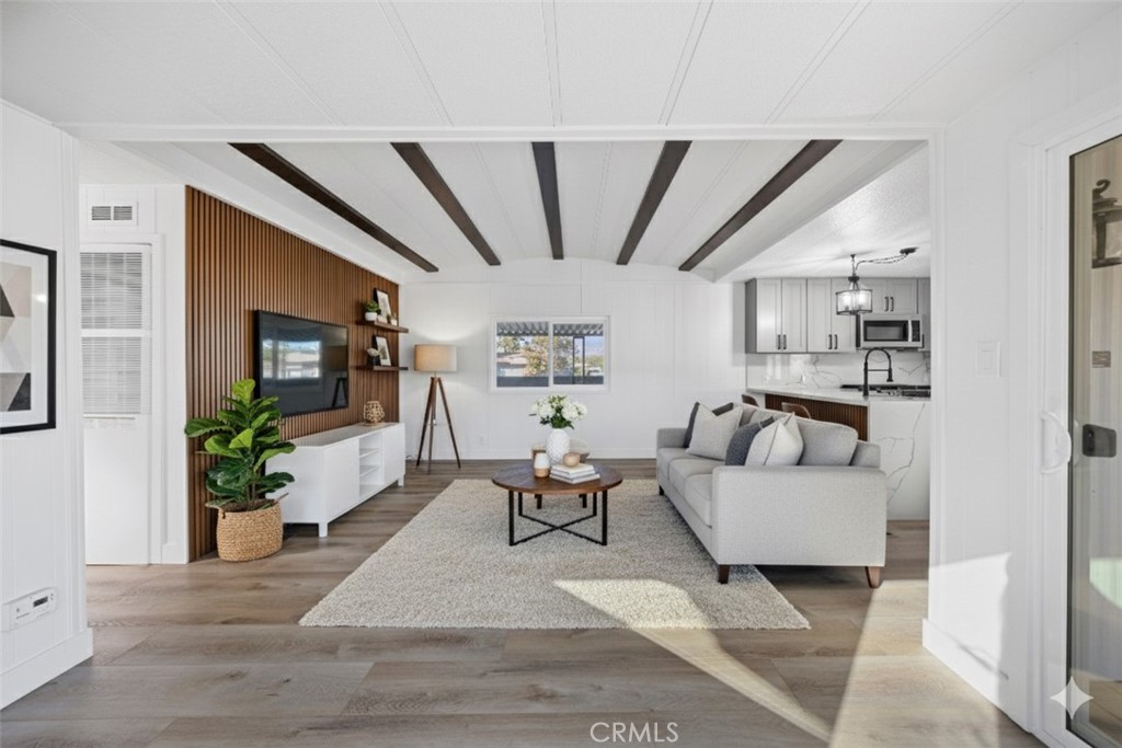 1255 Amethyst Street, Unit 51 Mentone, CA 92359 - Photo 20 of 60 a living room with furniture and a large window