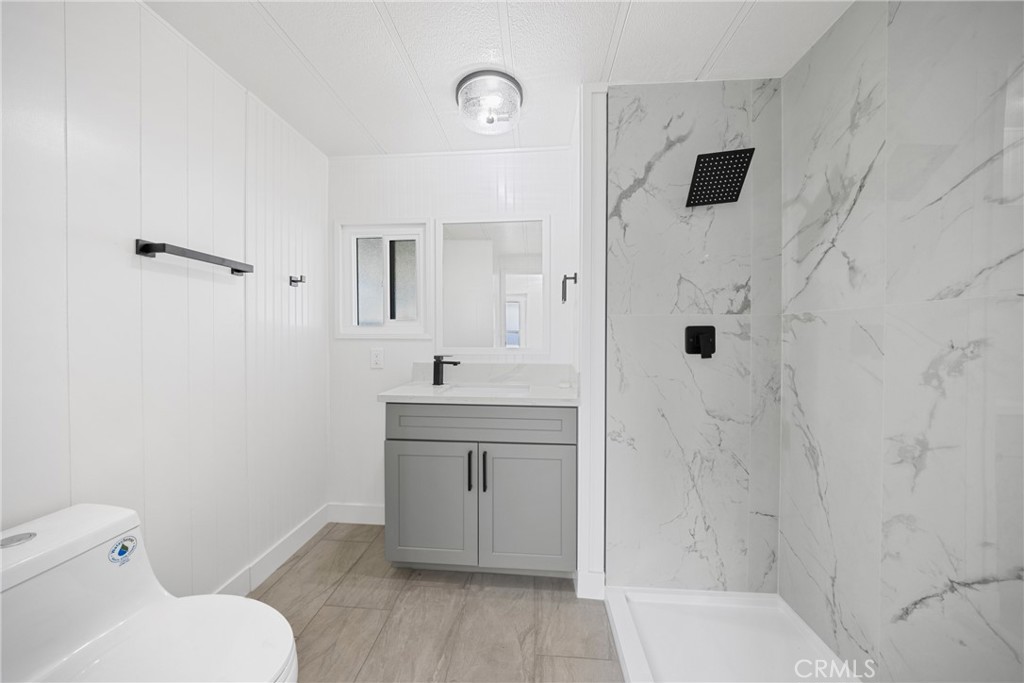 1255 Amethyst Street, Unit 51 Mentone, CA 92359 - Photo 22 of 60 a bathroom with a sink toilet and shower