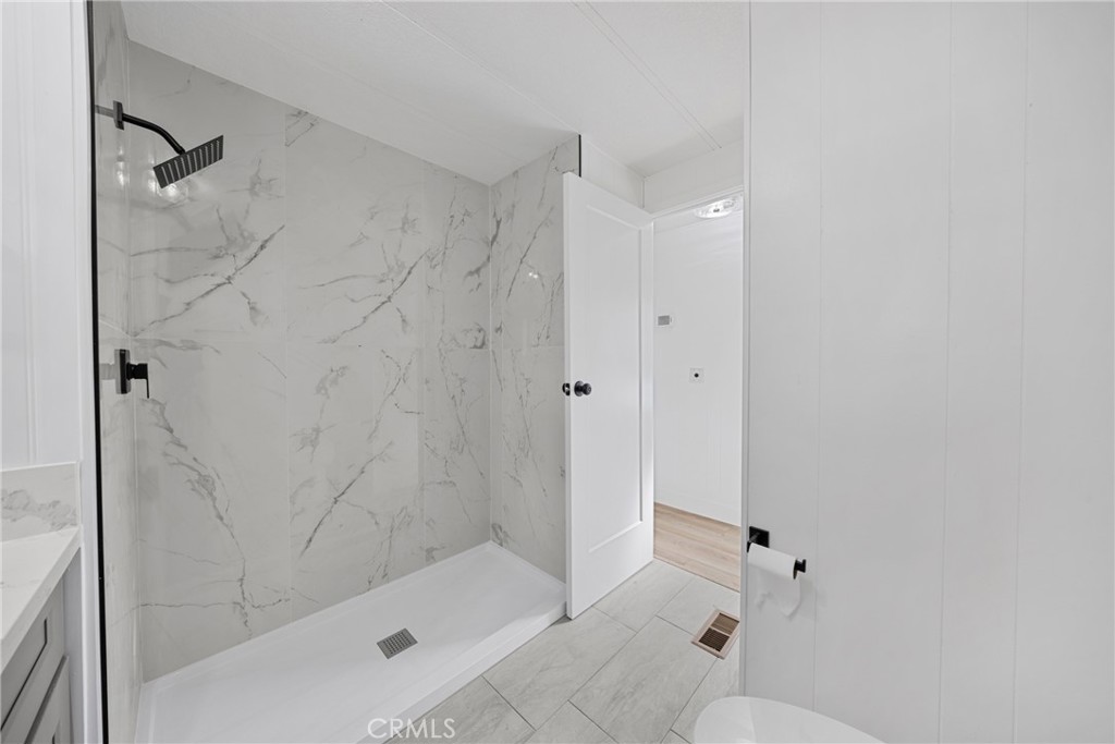 1255 Amethyst Street, Unit 51 Mentone, CA 92359 - Photo 23 of 60 a bathroom with a shower and bathtub