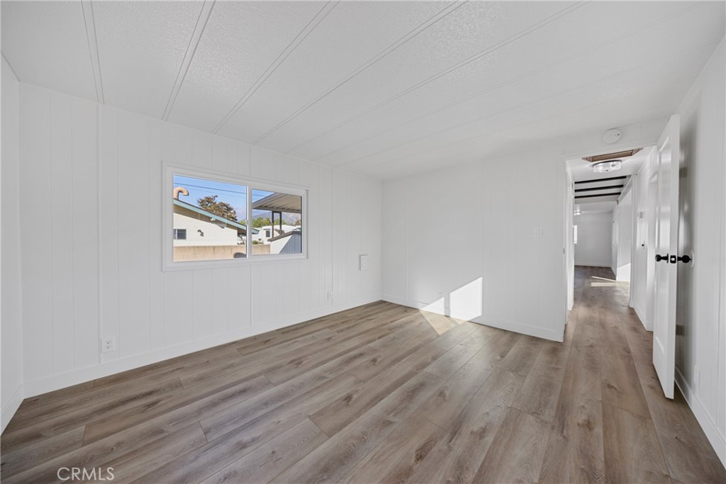 1255 Amethyst Street, Unit 51 Mentone, CA 92359 - Photo 25 of 60 a view of empty room with wooden floor