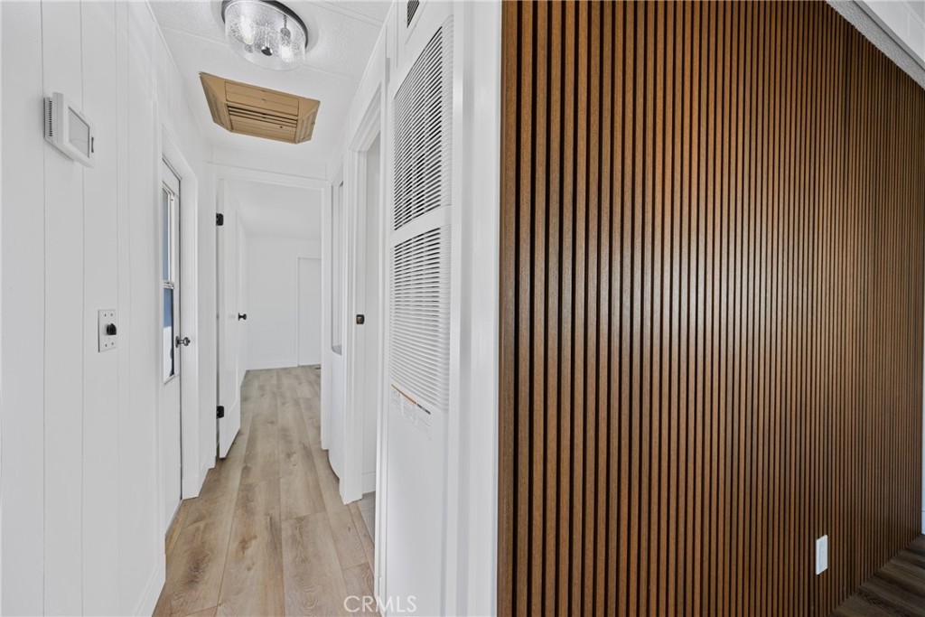 1255 Amethyst Street, Unit 51 Mentone, CA 92359 - Photo 29 of 60 a view of a hallway with closet