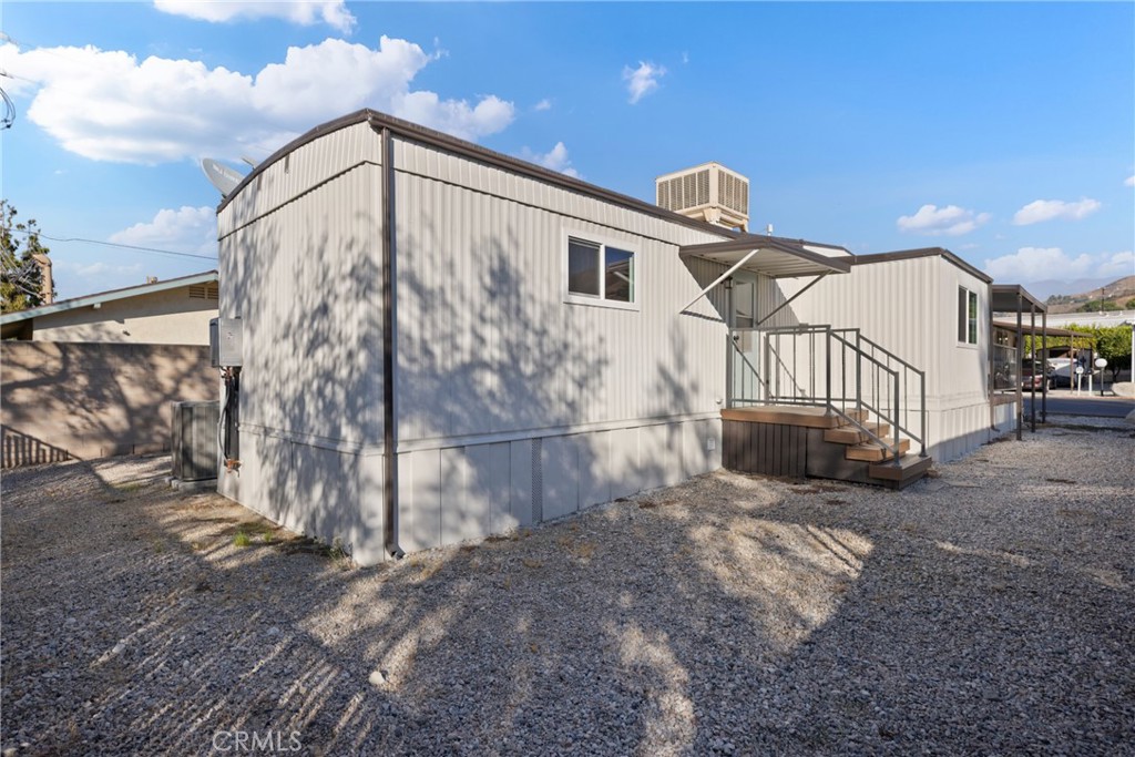 1255 Amethyst Street, Unit 51 Mentone, CA 92359 - Photo 34 of 60 a view of a house with a yard