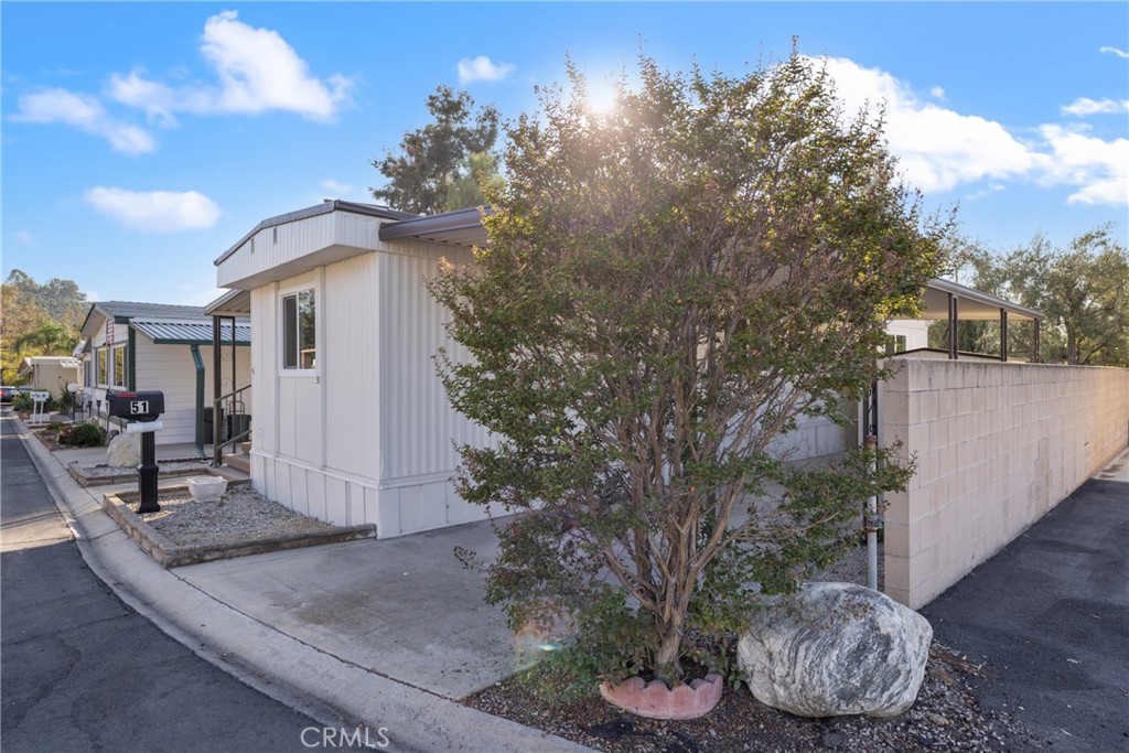 1255 Amethyst Street, Unit 51 Mentone, CA 92359 - Photo 40 of 60 a view of a patio with chair and tables
