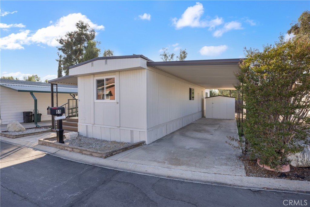 1255 Amethyst Street, Unit 51 Mentone, CA 92359 - Photo 41 of 60 a view of a house with a yard