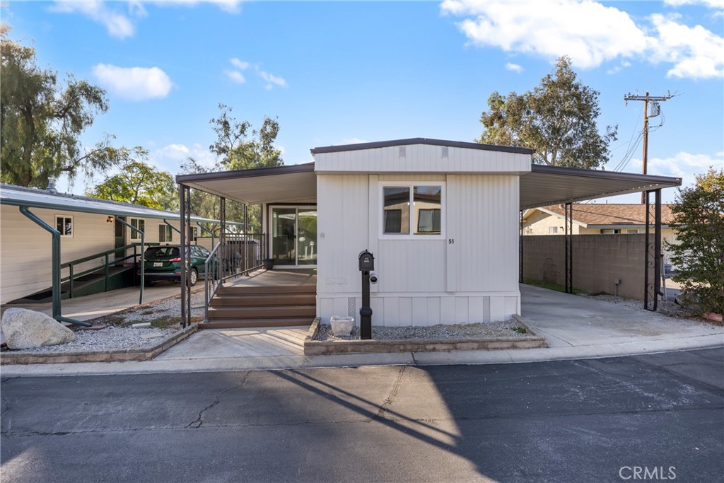 1255 Amethyst Street, Unit 51 Mentone, CA 92359 - Photo 42 of 60 a view of a house with a garage