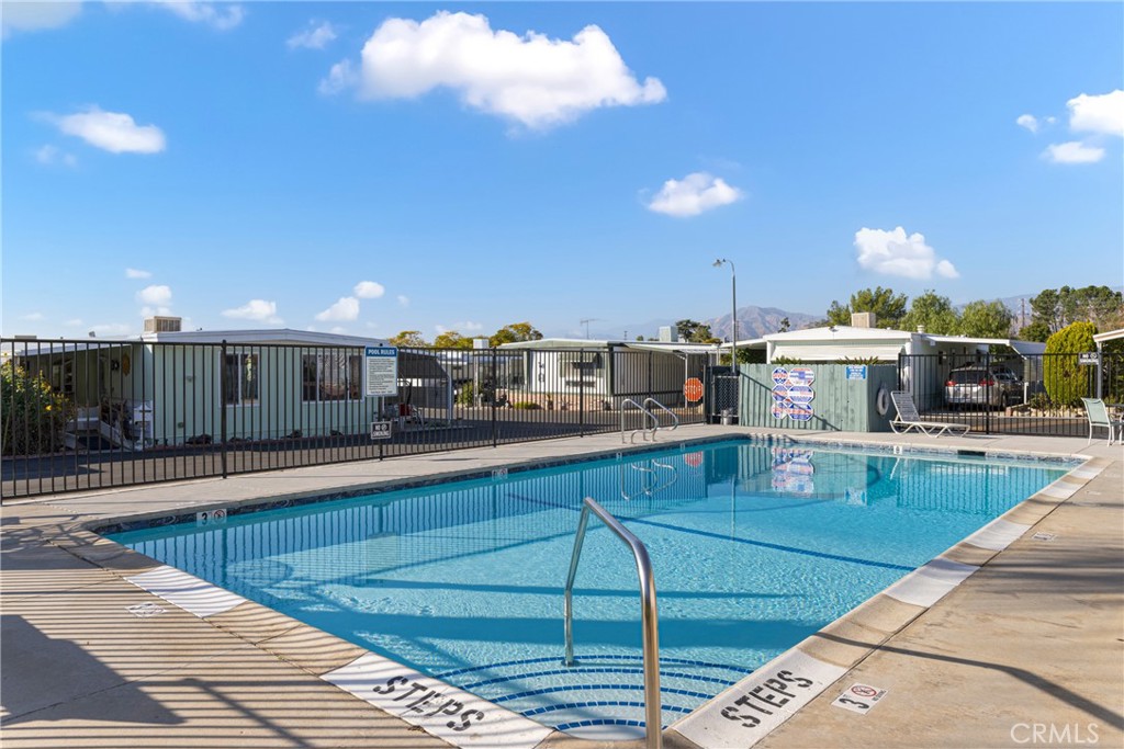 1255 Amethyst Street, Unit 51 Mentone, CA 92359 - Photo 56 of 60 a view of a kitchen with kitchen island a large island in the center