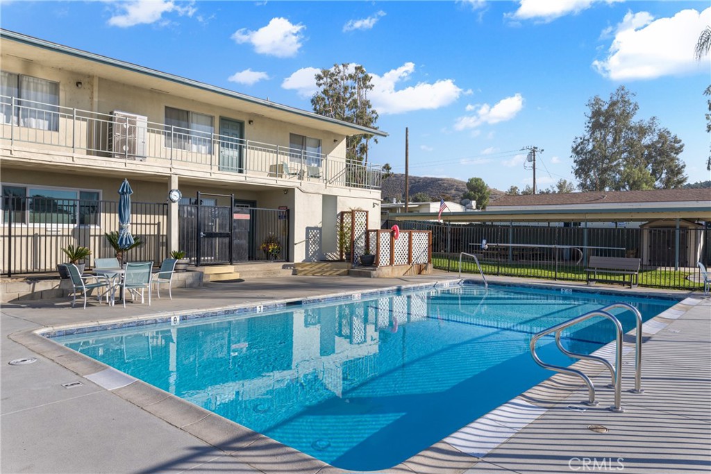 1255 Amethyst Street, Unit 51 Mentone, CA 92359 - Photo 57 of 60 a view of a swimming pool with sitting area