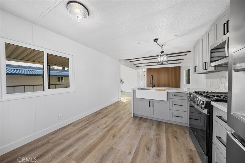 1255 Amethyst Street, Unit 51 Mentone, CA 92359 - Photo 10 of 60 a kitchen with cabinets stove and oven