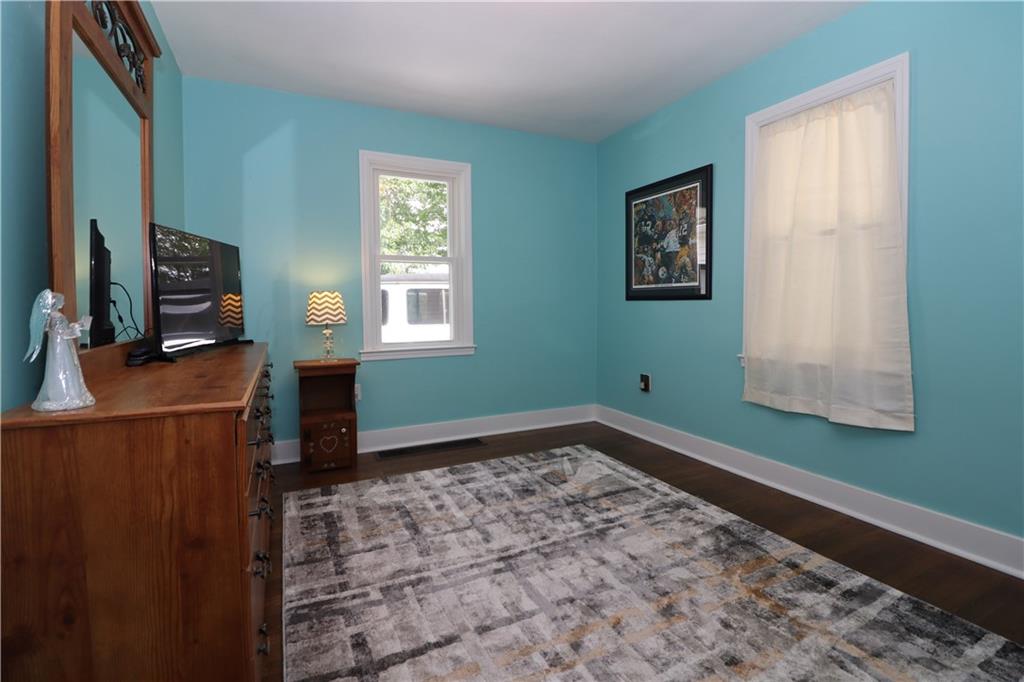 418 Pine Hill Road Kittanning, PA 16201 - Photo 13 of 20 a view of a room with window ceiling fan and wooden floor