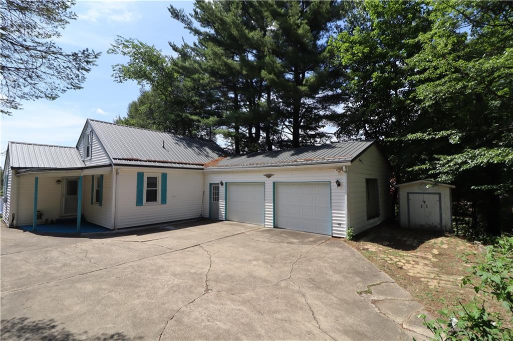 418 Pine Hill Road Kittanning, PA 16201 - Photo 4 of 20 a backyard of a house with large trees