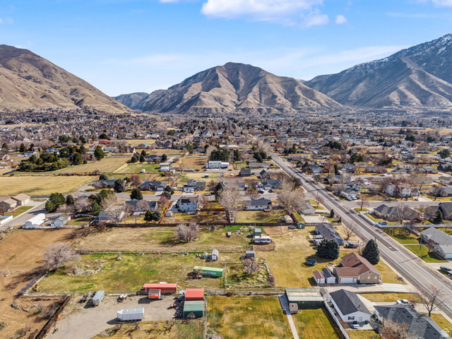 598 West 1600th Street North Mapleton, UT 84664 - Photo 28 of 34 Aerial perspective of suburban area featuring a mountain backdrop