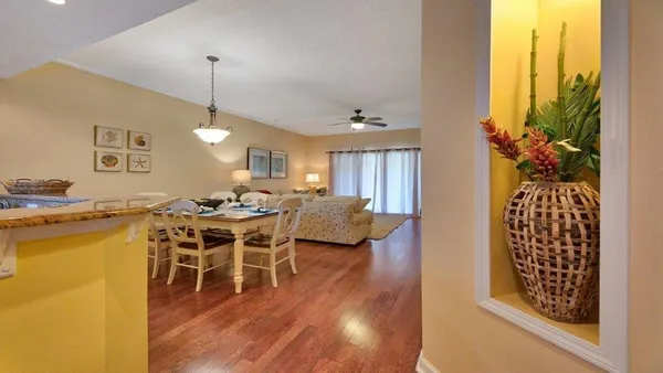 a view of a dining room with furniture window and wooden floor