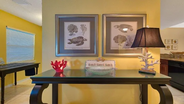 a bathroom with a sink mirror and vanity