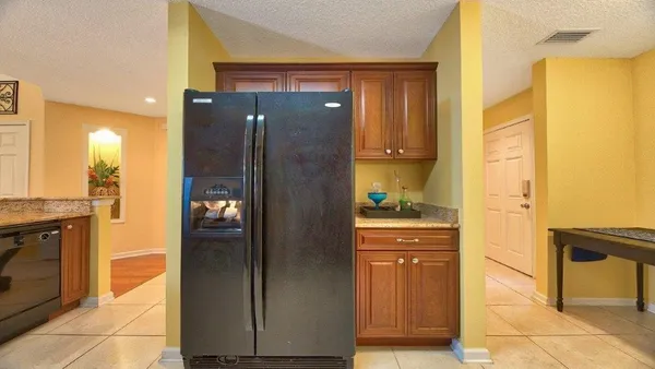 a bathroom with a glass door shower a mirror and a sink