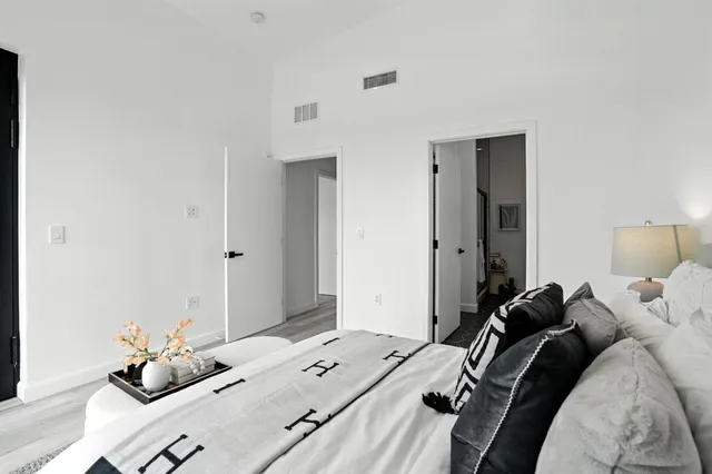 a bed room with a bed and a window