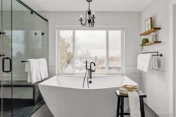 a bathroom with a tub and shower