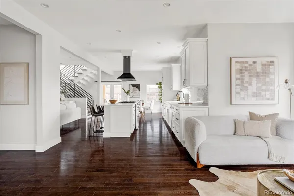 a kitchen with a sink appliances and cabinets