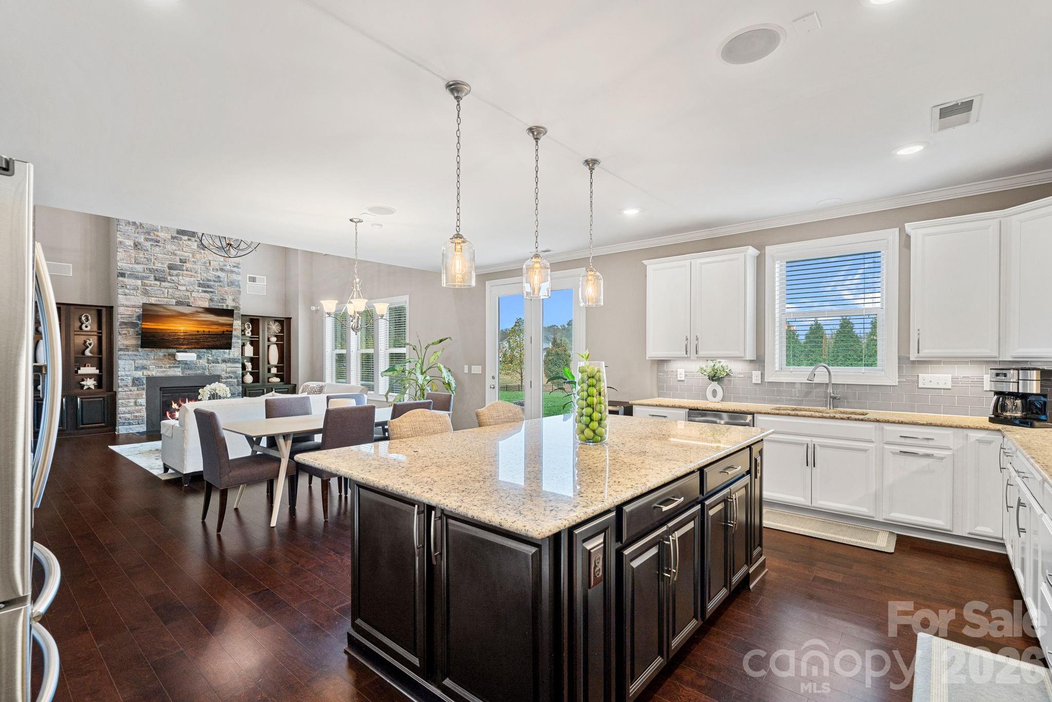 706 Blaise Court Matthews, NC 28104 - Photo 15 of 48 a kitchen with a stove sink and cabinets