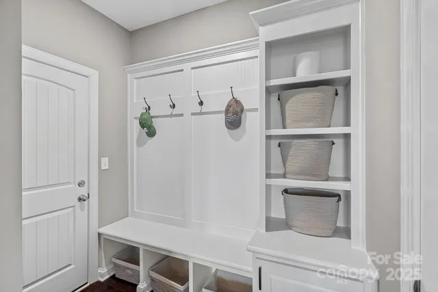 a bathroom with a window and mirror