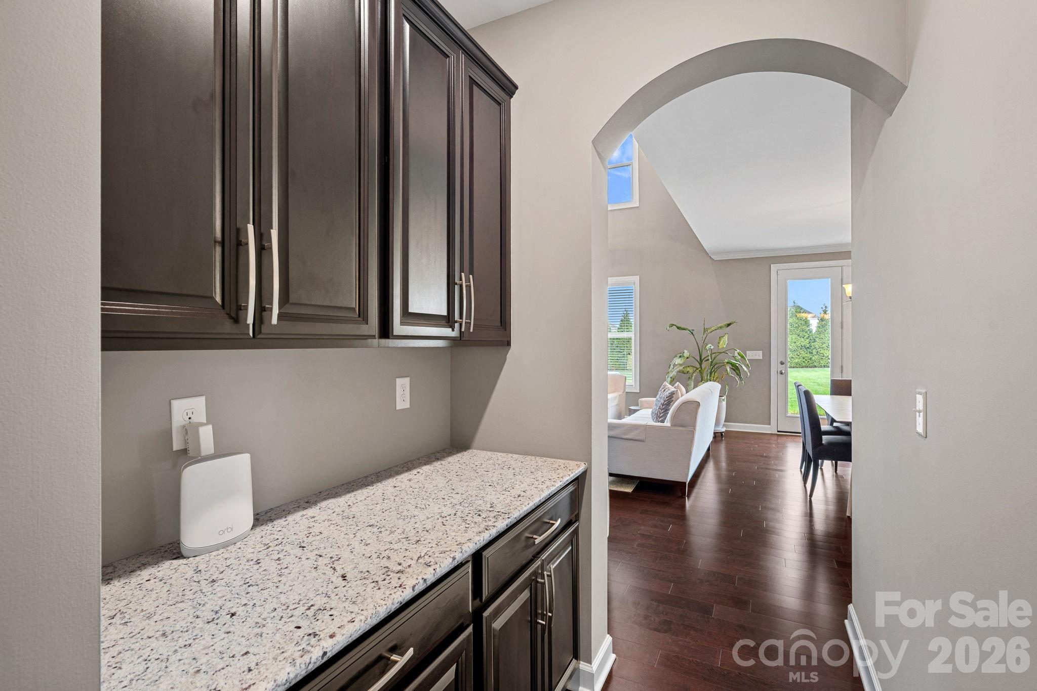 706 Blaise Court Matthews, NC 28104 - Photo 21 of 48 a view of a kitchen area with furniture and wooden floor