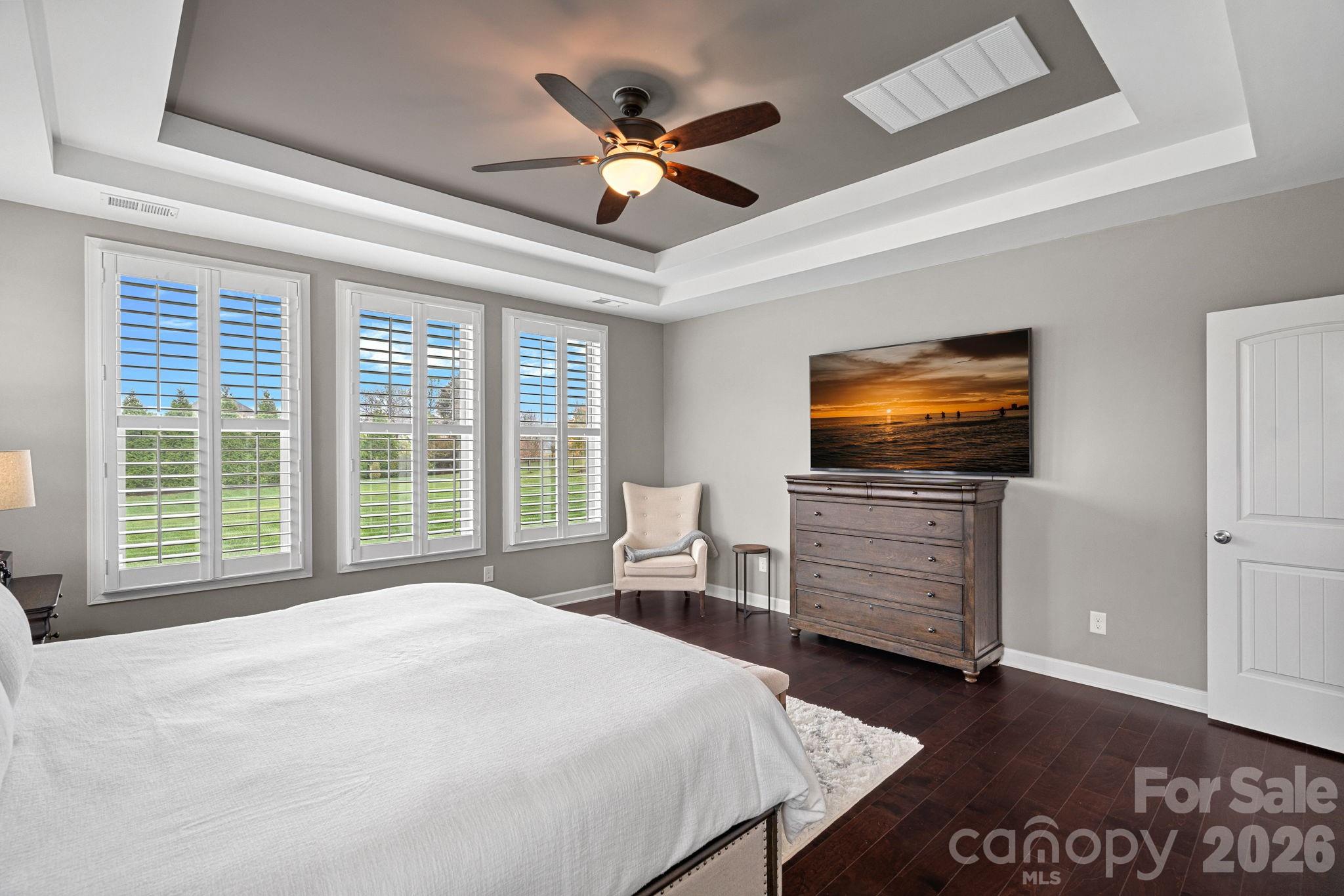 706 Blaise Court Matthews, NC 28104 - Photo 23 of 48 a bedroom with a bed and a flat screen tv