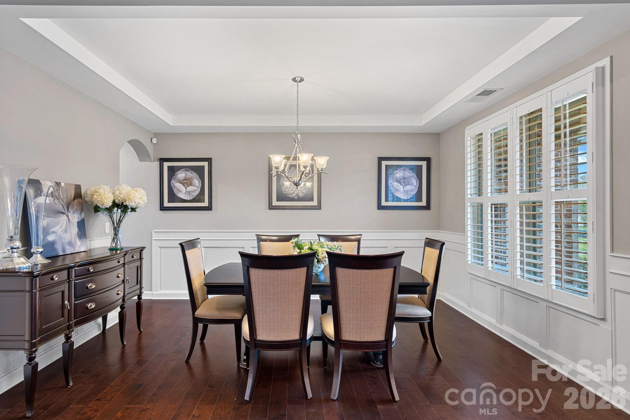 706 Blaise Court Matthews, NC 28104 - Photo 3 of 48 a view of a dining room with furniture window and wooden floor