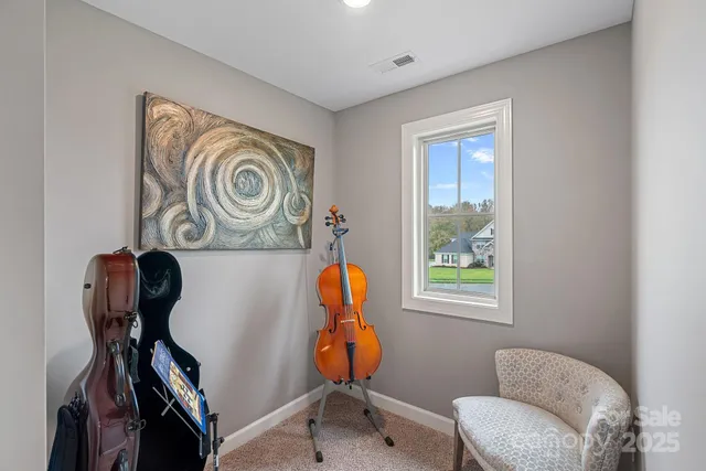a view of entryway with furniture and wooden floor