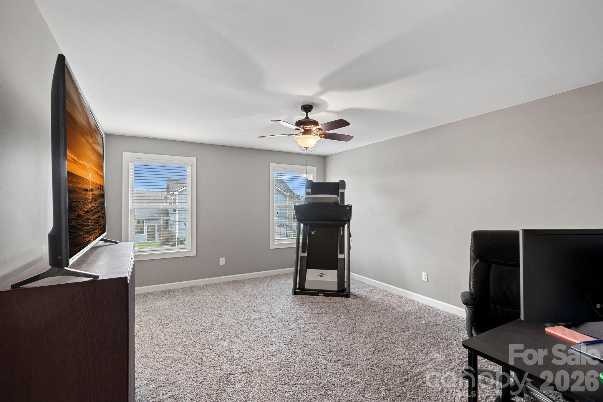 706 Blaise Court Matthews, NC 28104 - Photo 39 of 48 a living room with furniture and a flat screen tv