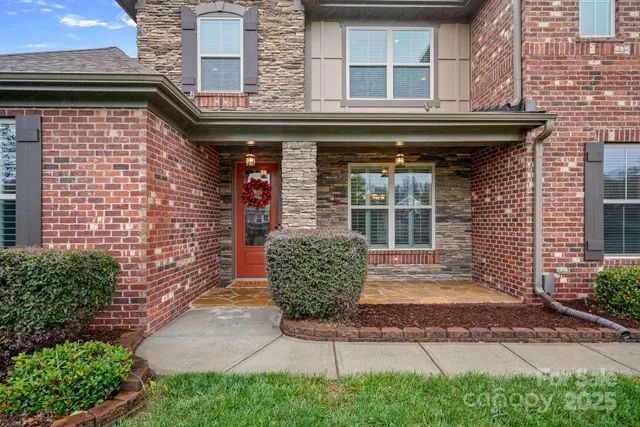 a front view of a building with garden
