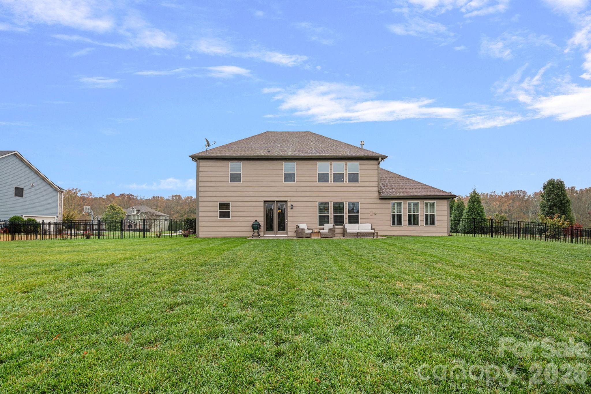 706 Blaise Court Matthews, NC 28104 - Photo 44 of 48 a view of a house with a big yard and large trees