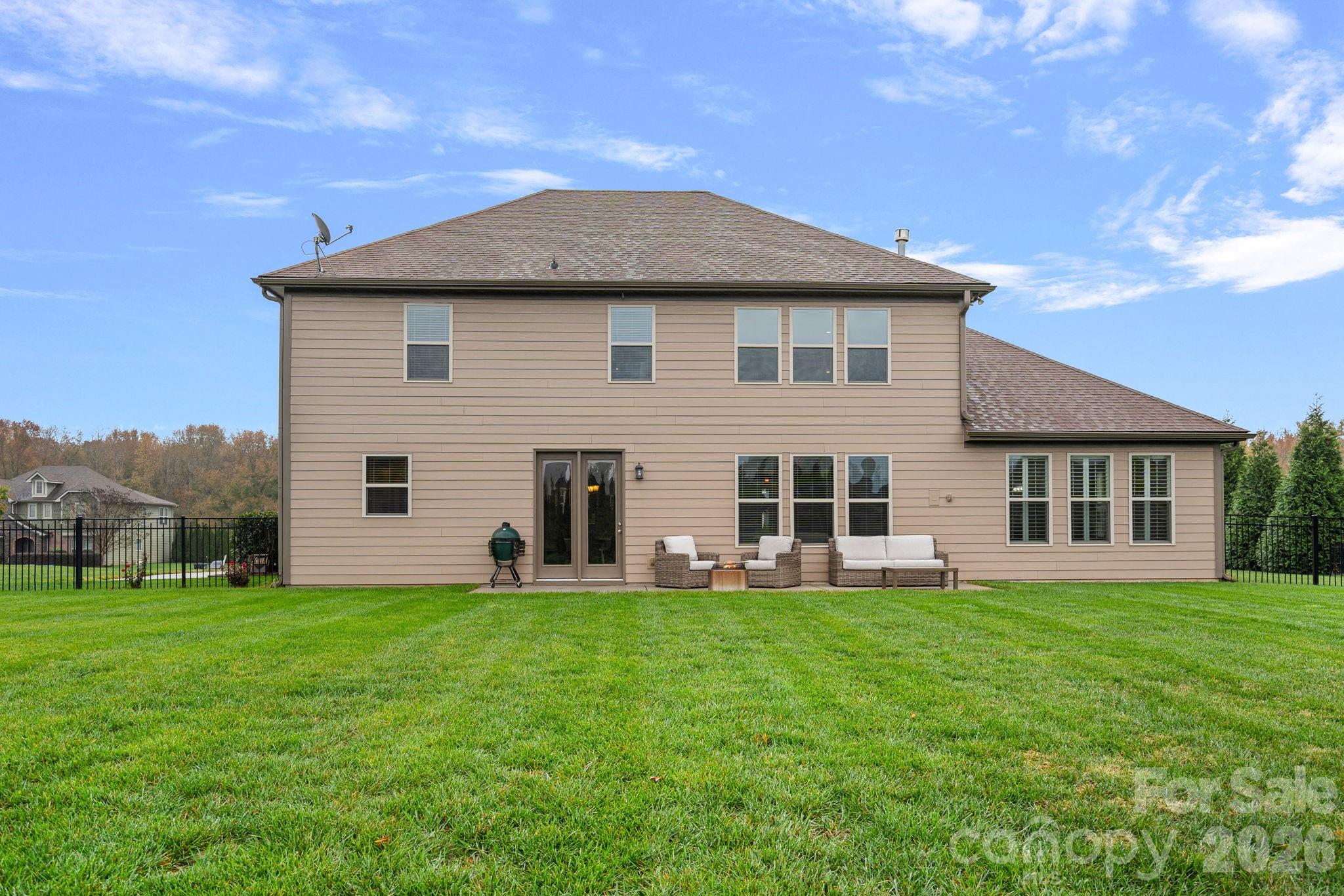 706 Blaise Court Matthews, NC 28104 - Photo 45 of 48 a front view of a house with a yard and trees