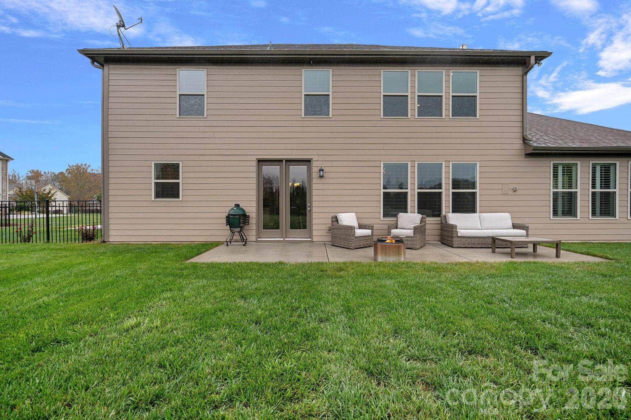 706 Blaise Court Matthews, NC 28104 - Photo 46 of 48 a backyard of a house with table and chairs