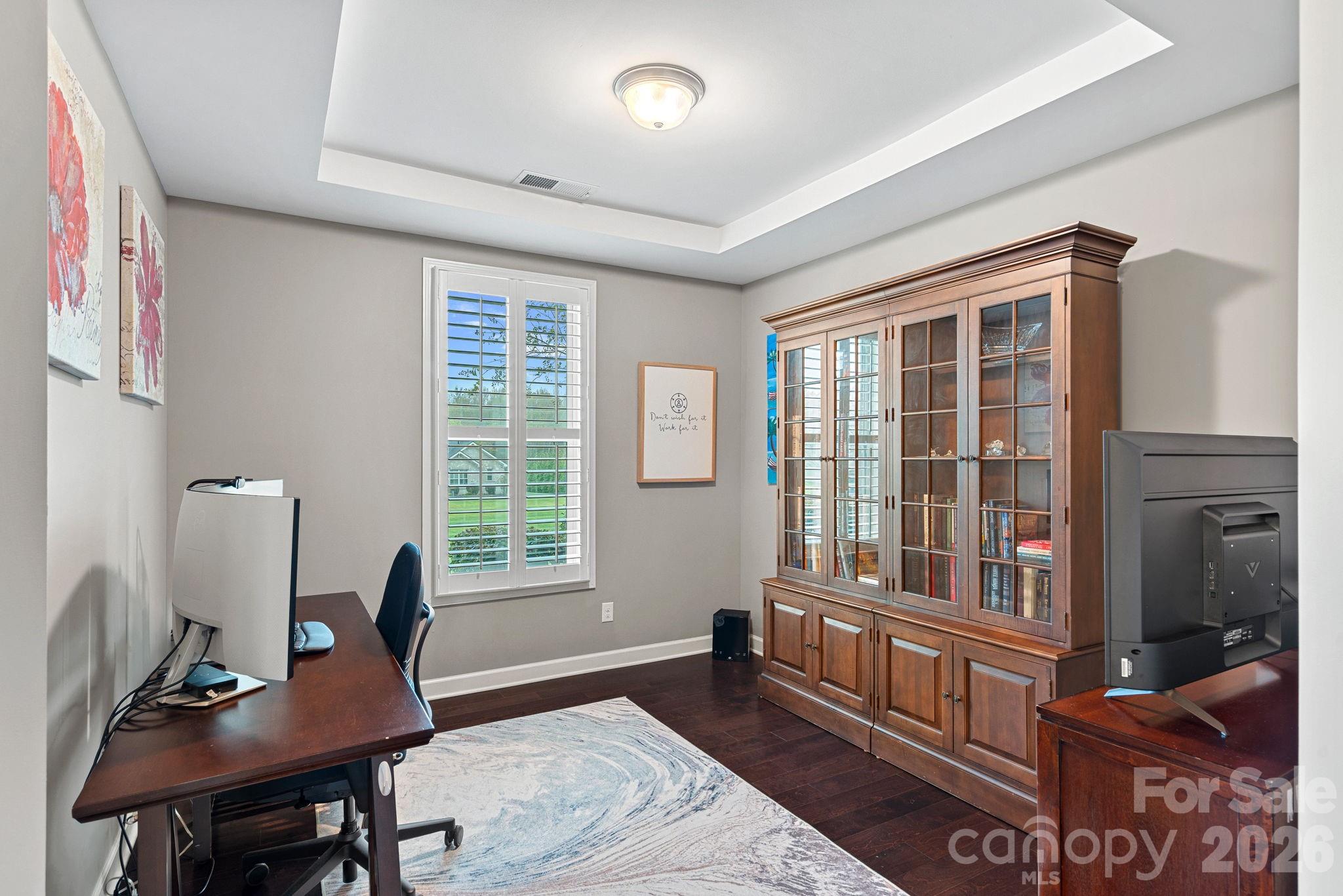 706 Blaise Court Matthews, NC 28104 - Photo 5 of 48 a workspace with furniture and a window