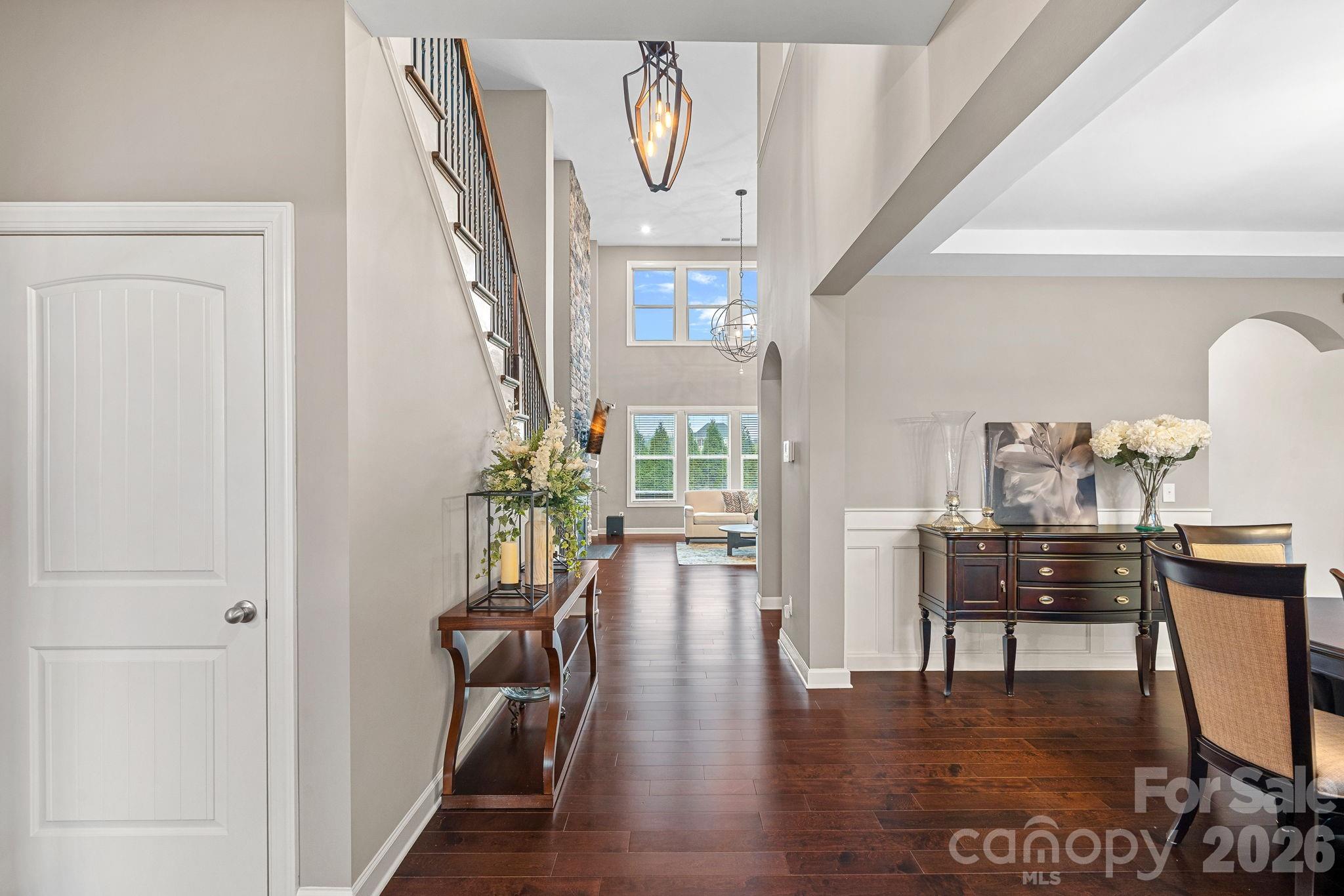 706 Blaise Court Matthews, NC 28104 - Photo 6 of 48 a view of a hallway with wooden floor table and windows