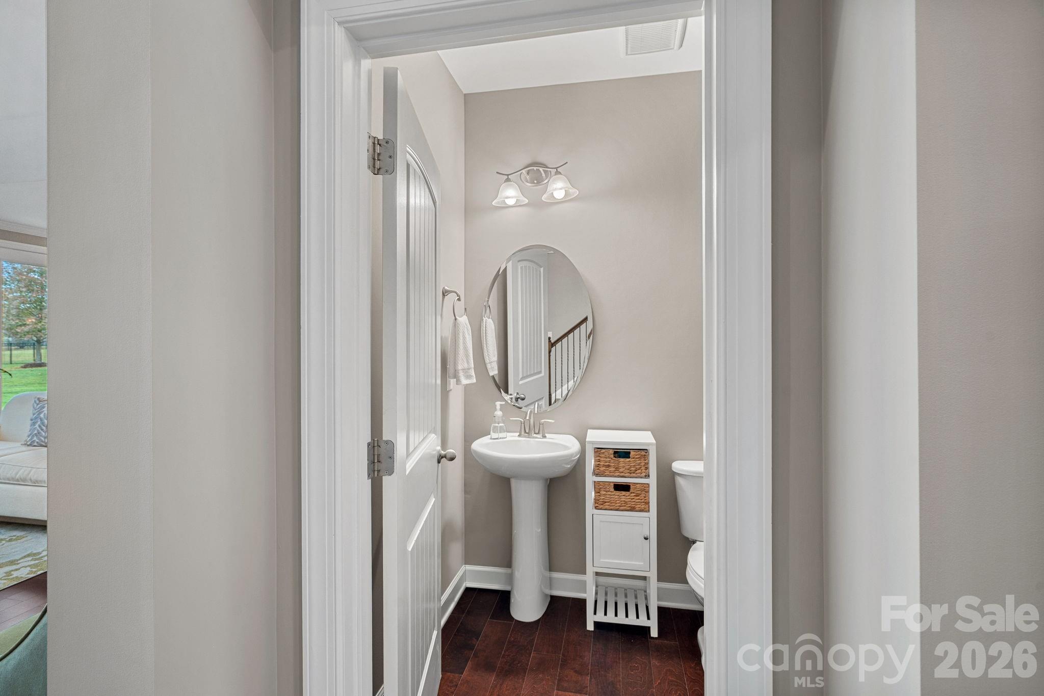 706 Blaise Court Matthews, NC 28104 - Photo 7 of 48 a view of a bathroom with a sink mirror and window