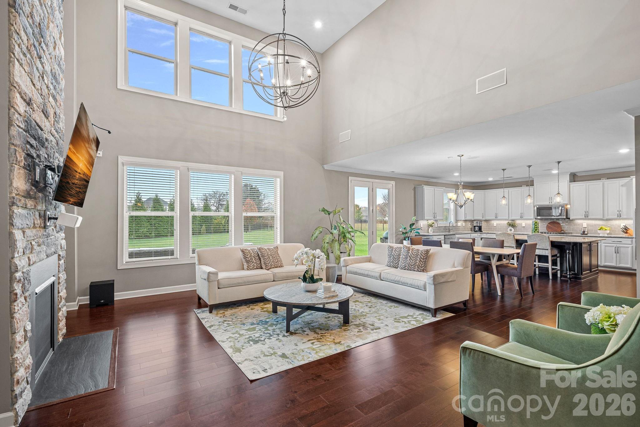 706 Blaise Court Matthews, NC 28104 - Photo 8 of 48 a living room with fireplace furniture and a large window