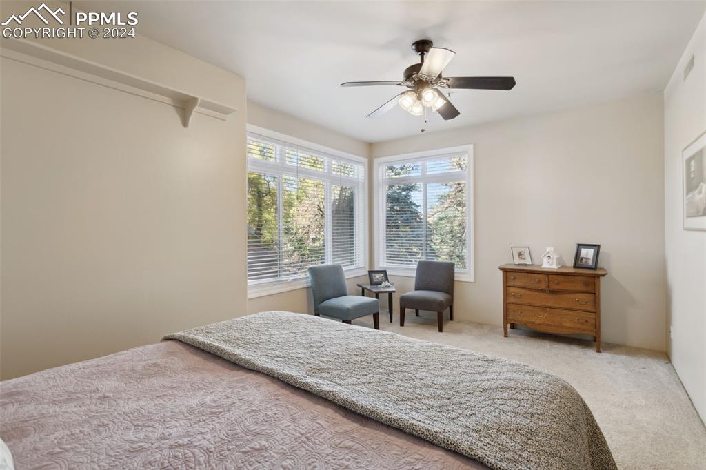 175 West Cheyenne Road, Unit 214 Colorado Springs, CO 80906 - Photo 12 of 28 a bedroom with furniture and a large window